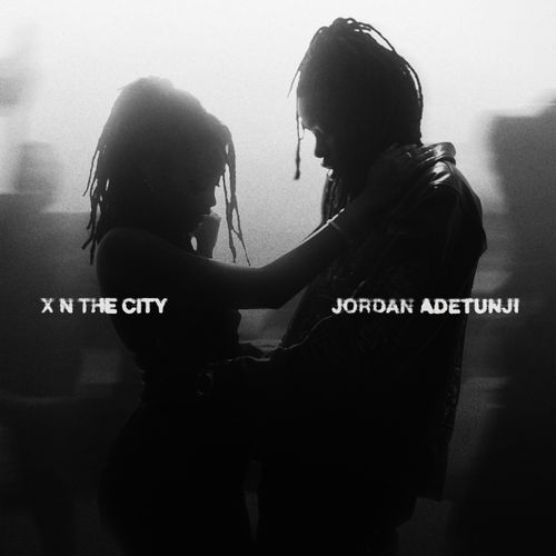 X n The City cover art