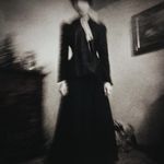the woman in the black dress artwork