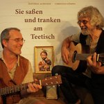 Sie saßen und tranken am Teetisch