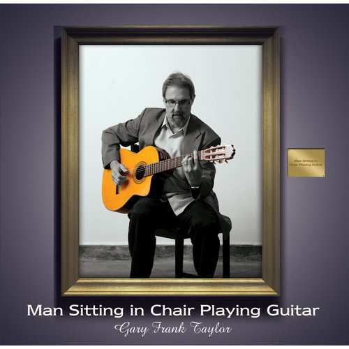 Man Sitting in Chair Playing Guitar