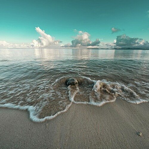 Woman On The Beach cover art